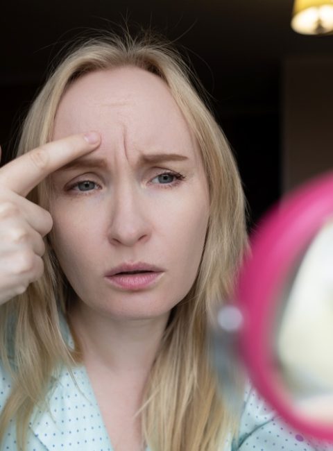 woman wondering if Botox can prevent frown lines from becoming permanent
